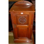 A late Victorian floral relief carved walnut ledgeback single door bedside cupboard, width 40.5cm