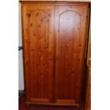 A modern pine effect double door wardrobe, width 113cm