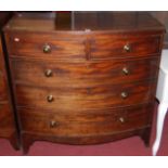 An early 19th century mahogany bowfront chest of two short over three long drawers having brass knob