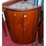 A 19th century mahogany bowfront hanging corner cupboard, h.101cm