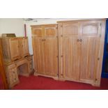 A 1930s limed oak and linenfold panelled bedroom suite, comprising; a larger and smaller double door