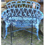 A blue painted cast and pierced metal two seater garden bench, width 95m, together with a wrought