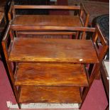 A pair of stained ply three-tier folding bookshelves, width 70.5cm