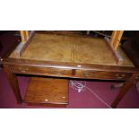 An early 20th century mahogany and leather inset two drawer writing table, width 152cm