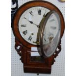 A Victorian figured walnut circular drop trunk wall clock, with pendulum and key