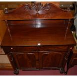 A William IV mahogany chiffonier, having a raised superstructure, twin frieze drawers over arched