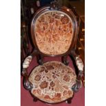 A mid-Victorian carved mahogany framed and floral buttoned upholstered spoon back open armchair,