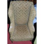 A 19th century mahogany framed and green floral upholstered wingback armchair, together with a