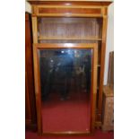 A late 19th century French walnut and burr walnut detailed single bevelled mirror door armoire,