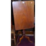 A Victorian mahogany round cornered tilt-top pedestal tripod table