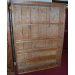 A large rustic pine free-standing open bookshelf, width 147cm