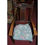 An early 20th century oak splat back armchair, together with a pair of beech stick back kitchen