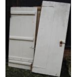 Two white painted interior doors with iron strapwork hinges, together with one further pine