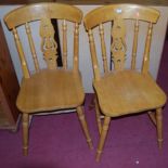 A pair of contemporary beech splat back kitchen chairs