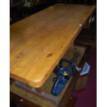 A modern pine rectangular trestle end kitchen table, length 168cm