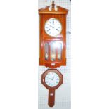 A stained beech drop trunk wall clock, together with a further wall clock (2)