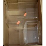 One box containing a collection of perspex advertising display stands