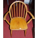 An Ercol elm stickback elbow chair, width 61cm