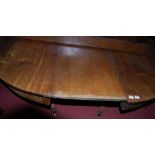 A 19th century mahogany D-end extending twin pillar dining table, having single extra drop-in