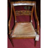 A circa 1900 mahogany and satinwood inlaid barback elbow chair, having a studded fixed pad seat