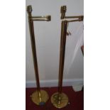 A pair of contemporary brass standard lamps, each with movable branch arms