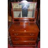 A late Victorian mahogany and chequer strung swing mirror back three-drawer dressing chest, width