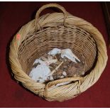 A woven wicker circular twin handled log basket, dia. 48cm