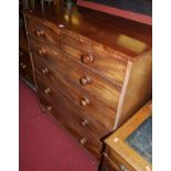 A mid-Victorian mahogany square front chest, of two short over four long graduated drawers on bun