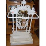 A Victorian cast iron and later white painted stick stand, having typical pierced floral