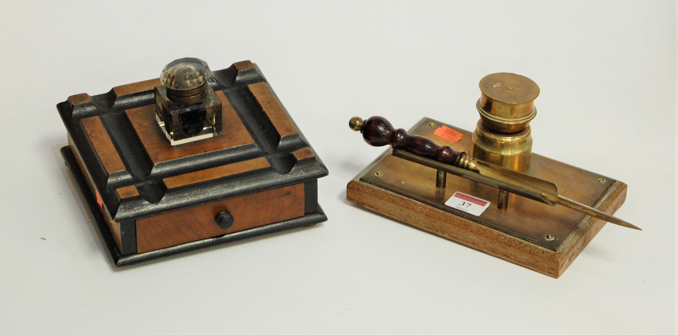 A Victorian walnut and ebonised desk stand, having single glass inkwell, with single drawer below;