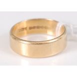 An 18ct yellow gold bevelled edge D-shaped wedding band, 5.6mm, finger size M, gross weight 4.7g,