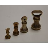 Four various brass bell weights