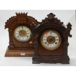 A late 19th century Ansonia Clock Company walnut cased mantel clock having an enamelled chapter ring