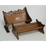 A Victorian stained beech book trough in the form of a bench having a fret carved back and ends,