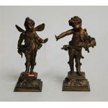 An early 20th century spelter figure of a putti in standing pose, on a concave square plinth;