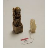 A polished hardstone desk seal carved as a sage, in standing pose with staff in hand, h.10cm;
