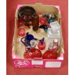 A box of miscellaneous items to include pair of cranberry glass ewers, Medina style paperweights,