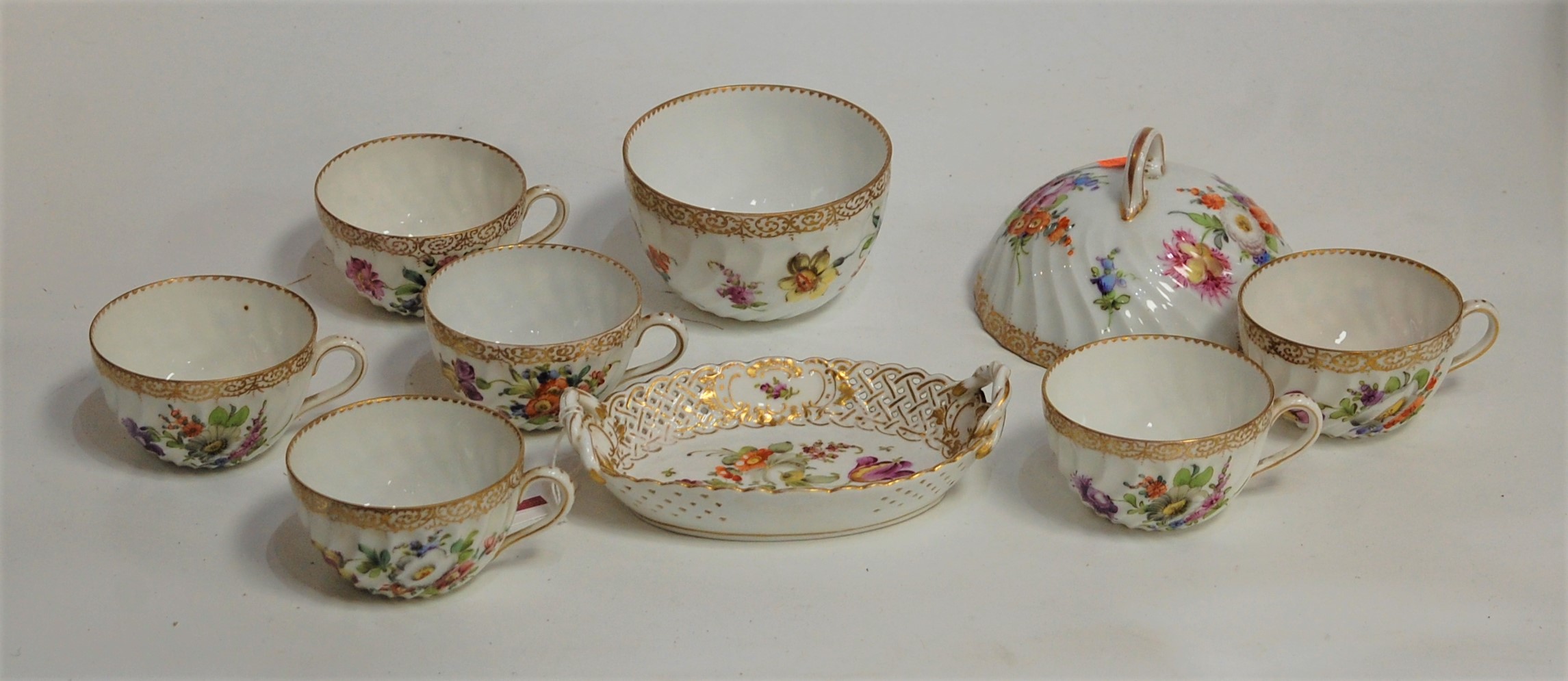 An early 20th century Dresden porcelain part tea service, of Wythern form, painted with roses and