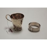 A George V silver christening mug, of plain tapering form; together with a silver bangle with engine