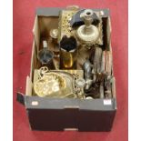 A box of miscellaneous items to include brass trivets, brass shell vase, bellows etc