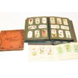 A cigarette card album and contents, to include John Player's; together with various other cigarette