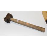 A cast iron sledgehammer with wooden handle, length 52cm