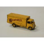 A Dinky Toys No.514 Weetabix Guy van, having a yellow body with yellow hubs and Weetabix livery (