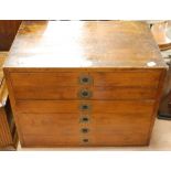 A mid 20th century stained beech collector's chest fitted with six short drawers each with velvet