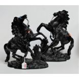 After Moreau - a pair of black painted spelter figures of the Marley horses, h.39cm