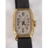 An Art Deco lady's Gruen Cincinnati 14ct gold cased tank watch, having a signed silvered dial, the