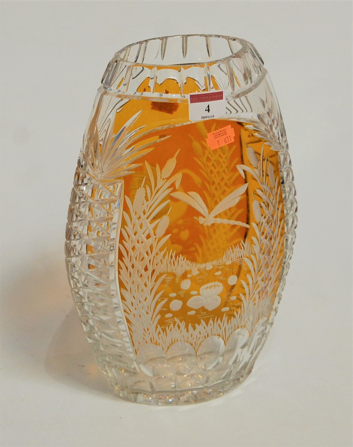 A large Bohemian style glass vase, of flattened oval form, amber overlaid and etched with a