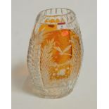 A large Bohemian style glass vase, of flattened oval form, amber overlaid and etched with a