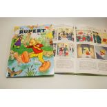 A collection of eight Rupert The Bear annuals