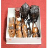 A box of late 20th century Tribal items, to include busts, wall masks etc